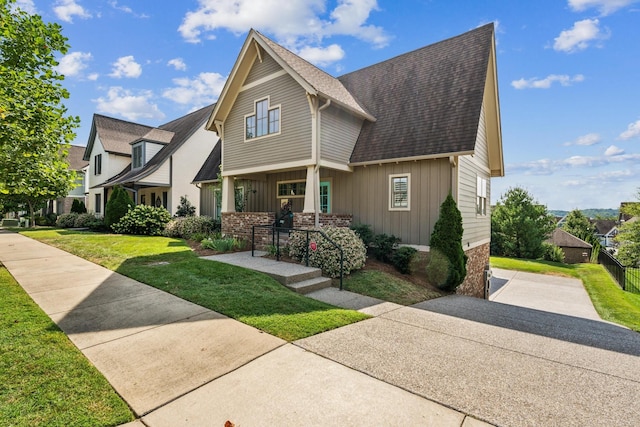 craftsman-style house with a front yard