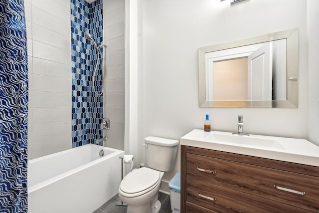 full bathroom with vanity, toilet, and tiled shower / bath combo