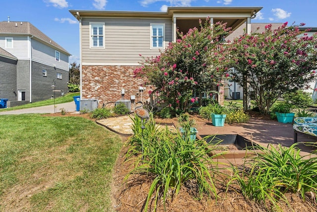 rear view of property with a lawn