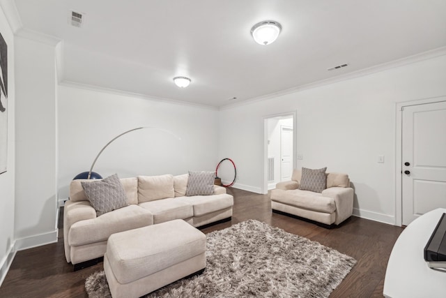 living room with dark hardwood / wood-style flooring and crown molding