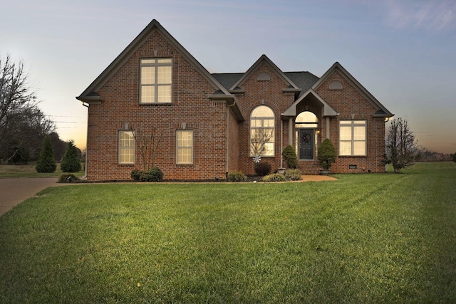 view of front of home with a lawn