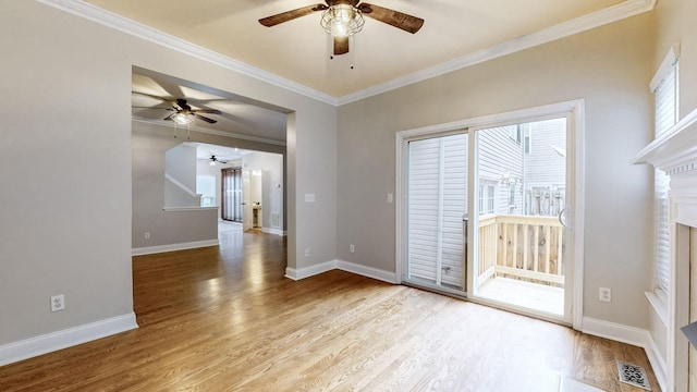 spare room with light hardwood / wood-style flooring and ornamental molding