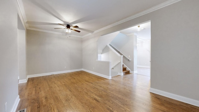 unfurnished room featuring ceiling fan, hardwood / wood-style floors, and ornamental molding