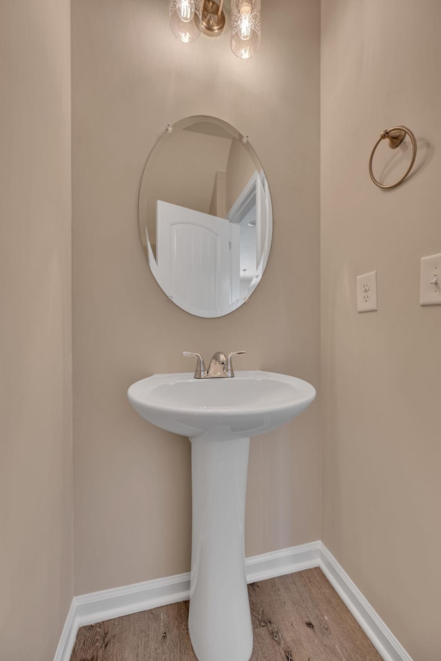 bathroom featuring sink and hardwood / wood-style flooring