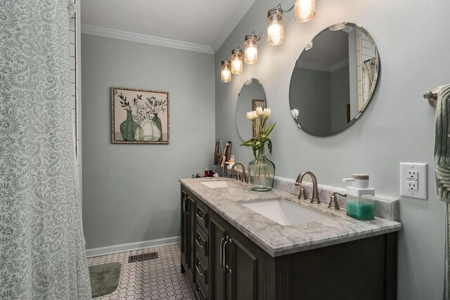 bathroom featuring vanity, tile patterned floors, and crown molding