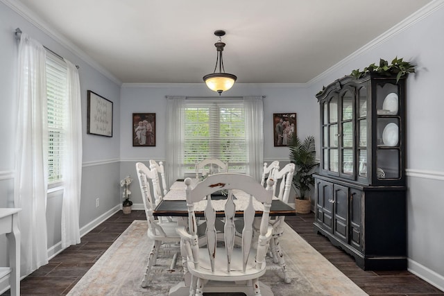 dining space featuring crown molding