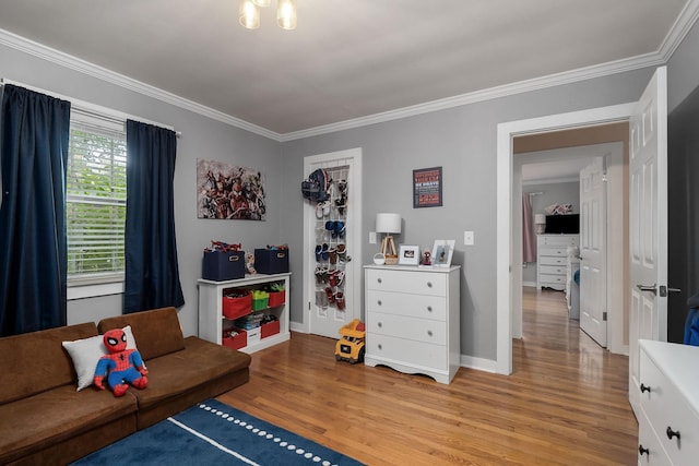 interior space with light hardwood / wood-style flooring and ornamental molding