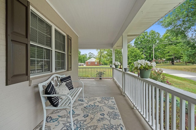 balcony featuring covered porch