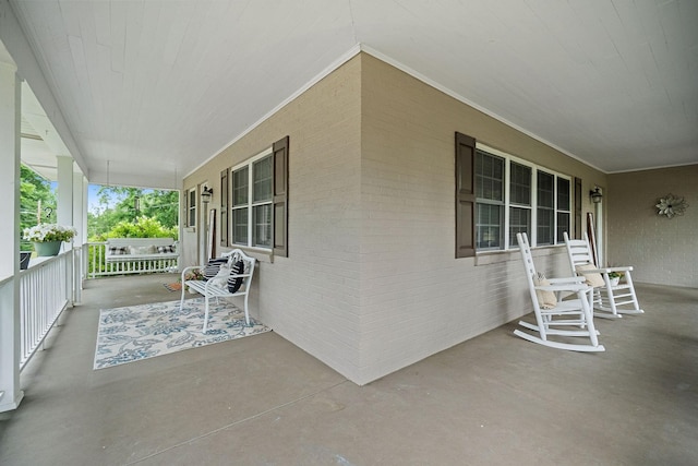 view of patio featuring a porch