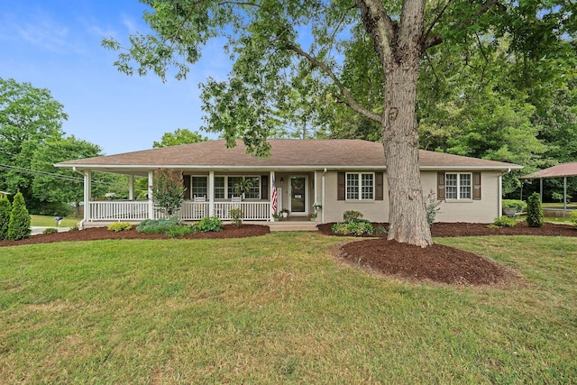 ranch-style home with a porch and a front lawn