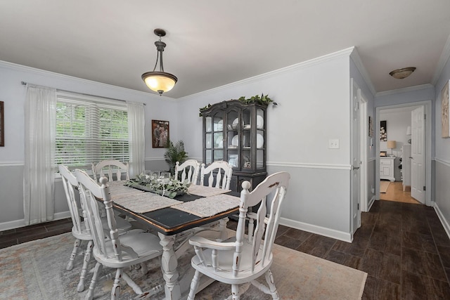 dining space featuring crown molding