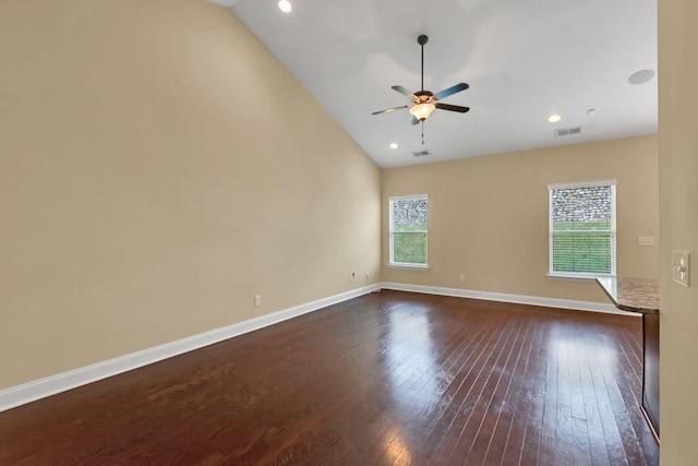 unfurnished room with dark hardwood / wood-style floors, vaulted ceiling, and ceiling fan