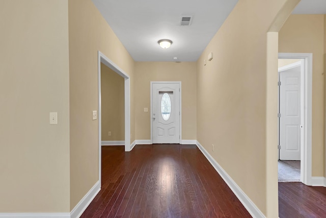 foyer with dark hardwood / wood-style flooring