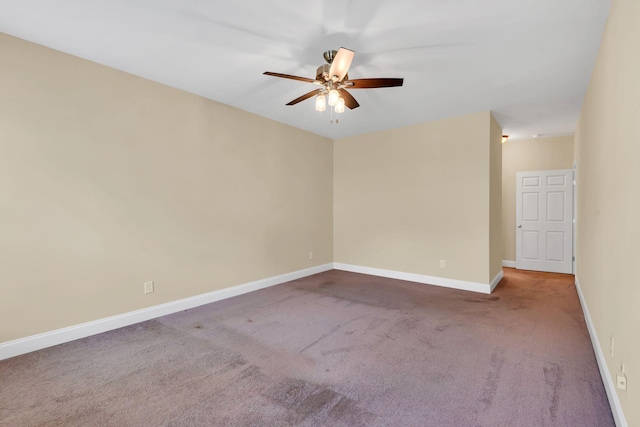 unfurnished room featuring ceiling fan and carpet floors