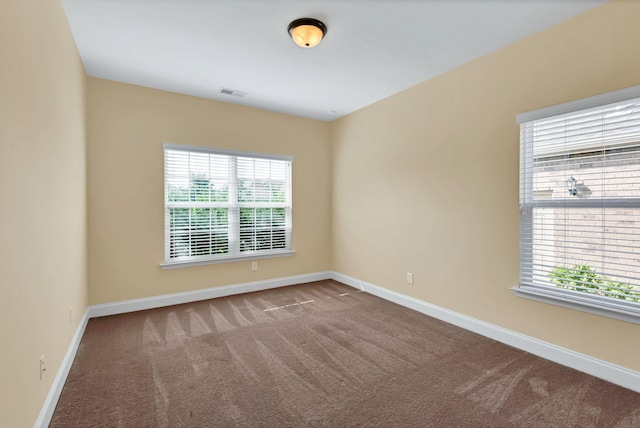 unfurnished room with carpet flooring