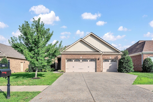 craftsman-style home featuring a front yard and a garage