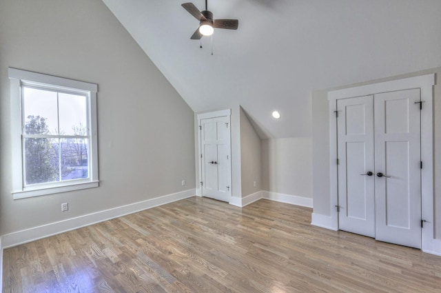 bonus room featuring ceiling fan, vaulted ceiling, and light wood-type flooring