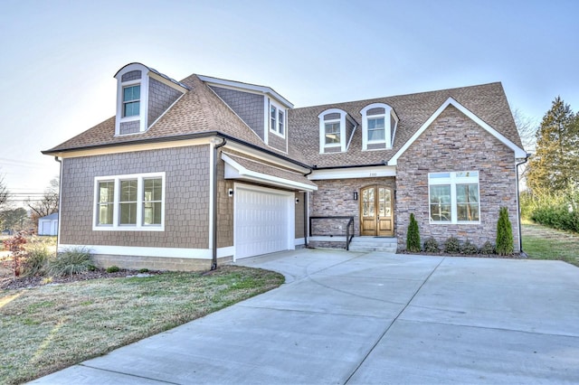 view of front of home featuring a garage and a front lawn