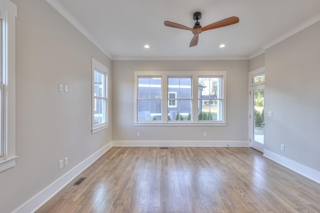 unfurnished room with crown molding, ceiling fan, and light wood-type flooring