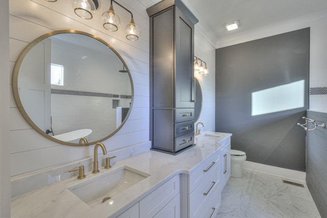 bathroom with vanity, ornamental molding, and toilet