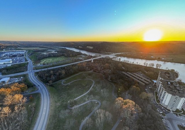 aerial view at dusk with a water view