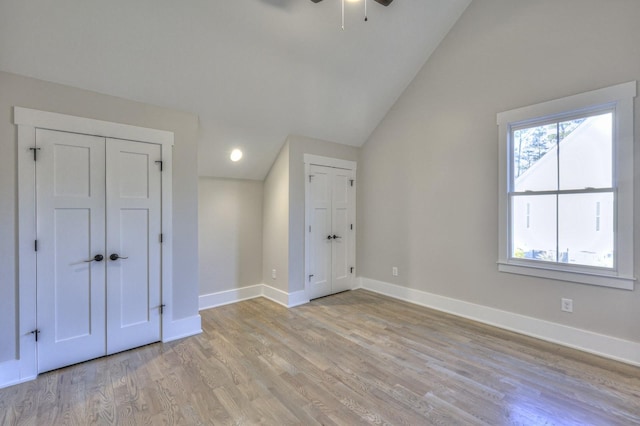 interior space with light hardwood / wood-style flooring and vaulted ceiling