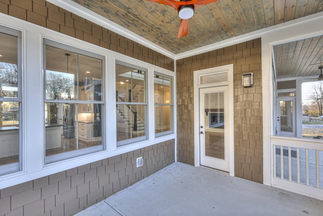 exterior space with ceiling fan and wooden ceiling