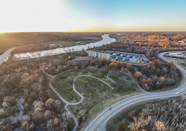 aerial view at dusk with a water view