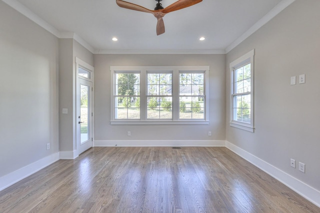 spare room featuring ceiling fan, light hardwood / wood-style flooring, and ornamental molding