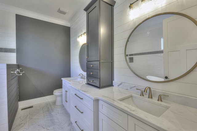 bathroom featuring crown molding, vanity, and toilet