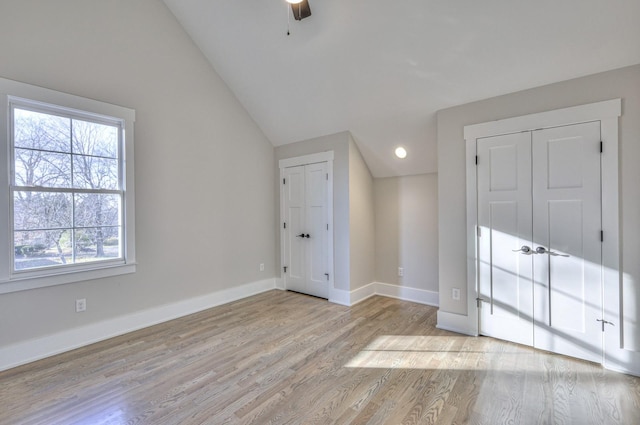 bonus room with ceiling fan, vaulted ceiling, and light wood-type flooring