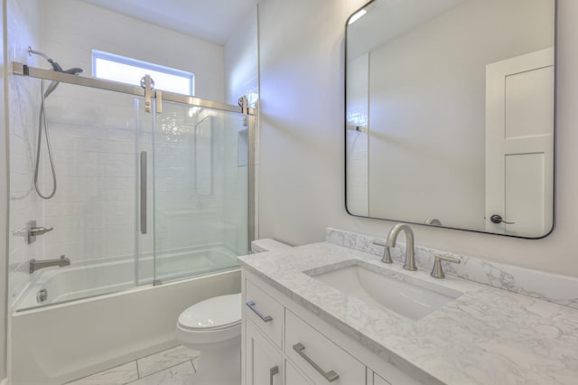 full bathroom with vanity, toilet, and bath / shower combo with glass door