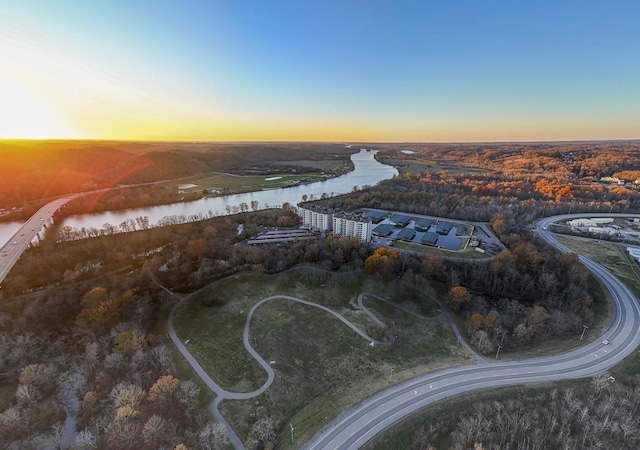 aerial view at dusk with a water view