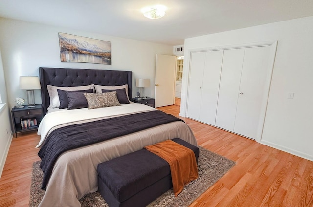 bedroom featuring a closet and light hardwood / wood-style flooring