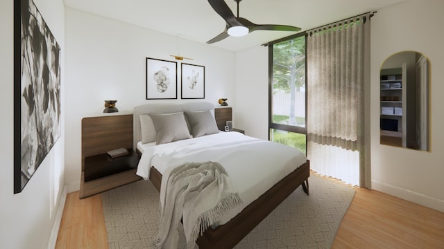 3525 Garner Rd Unit 1, Chattanooga, TN 37406 - bedroom with arched walkways, light wood-type flooring, and a ceiling fan