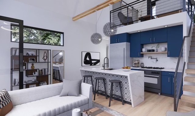 3525 Garner Rd Unit 2, Chattanooga, TN 37406 - kitchen with blue cabinetry, a towering ceiling, range with gas cooktop, freestanding refrigerator, and light wood finished floors