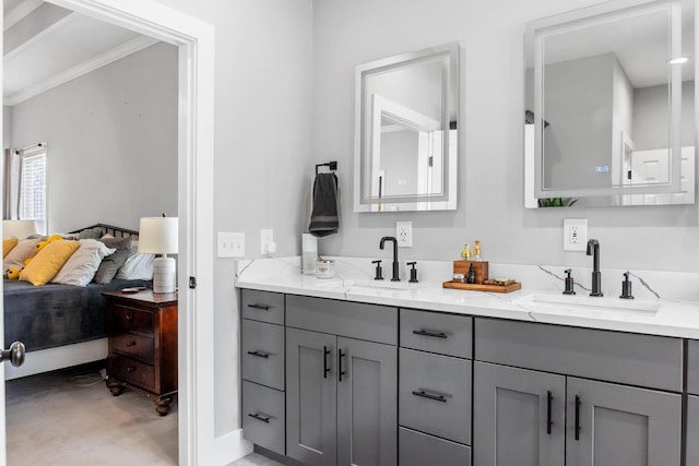 bathroom with vanity and ornamental molding