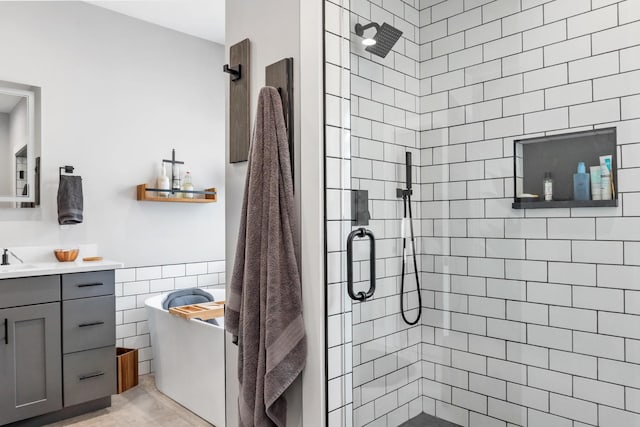 bathroom featuring vanity and a shower with shower door