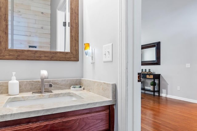 bathroom featuring vanity and wood-type flooring