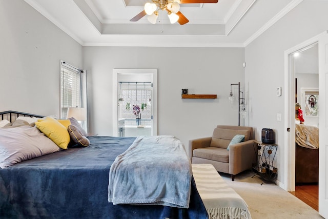 bedroom featuring a raised ceiling, ceiling fan, crown molding, and light hardwood / wood-style floors