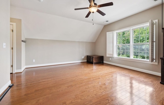 bonus room featuring ceiling fan, wood-type flooring, and vaulted ceiling