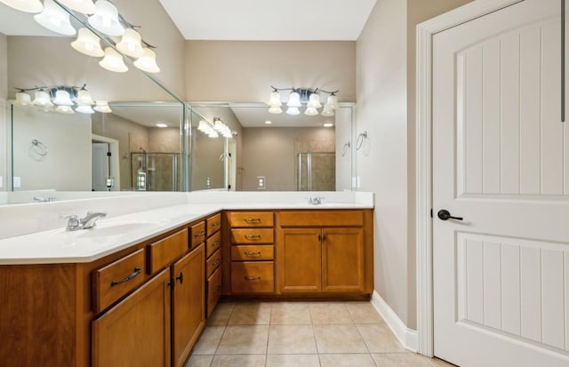 bathroom featuring tile patterned floors, vanity, and an enclosed shower