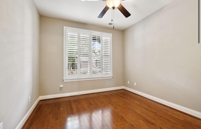 spare room with ceiling fan and hardwood / wood-style floors