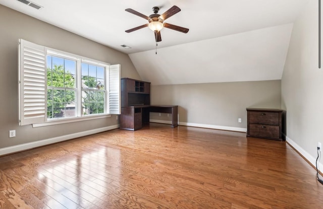 additional living space featuring ceiling fan, wood-type flooring, and vaulted ceiling