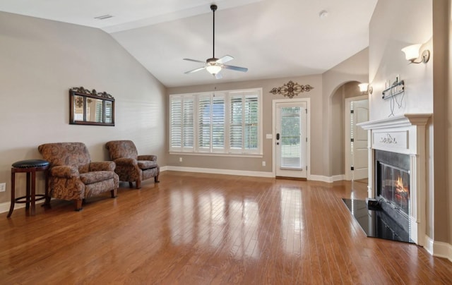 sitting room featuring hardwood / wood-style floors, ceiling fan, and lofted ceiling