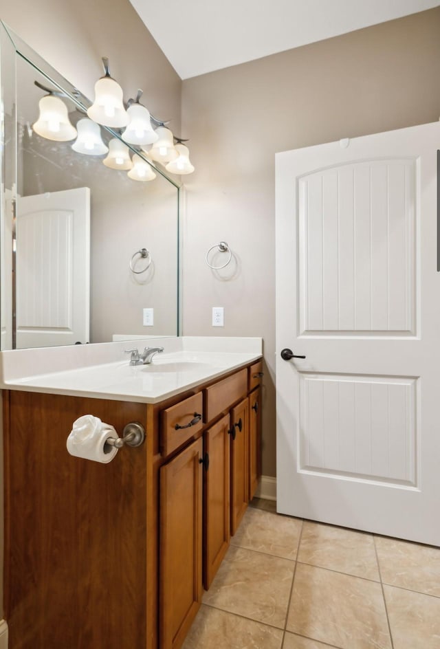 bathroom with tile patterned flooring and vanity