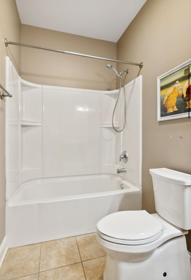 bathroom with toilet and tile patterned floors