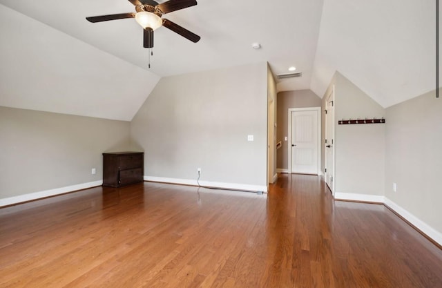 additional living space featuring ceiling fan, wood-type flooring, and lofted ceiling