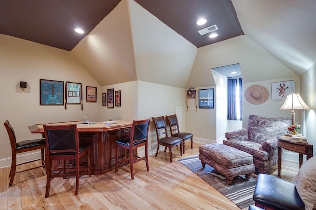 interior space featuring vaulted ceiling and light hardwood / wood-style flooring