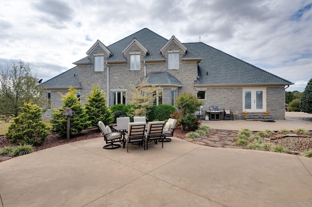 back of property with french doors and a patio